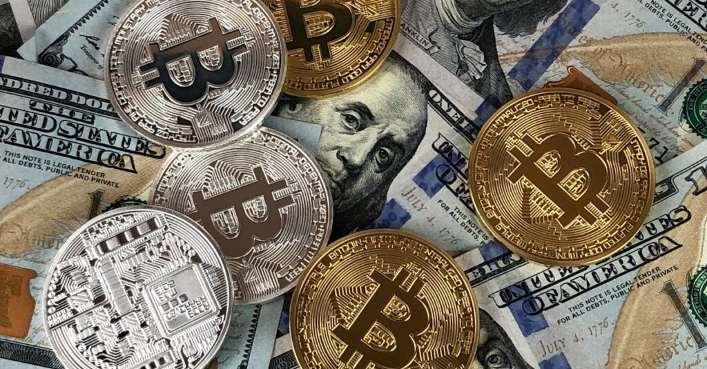 Close-up of bitcoins and US dollar bills symbolizing modern finance and cryptocurrency.