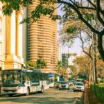 Vibrant street in Belo Horizonte, Brazil featuring distinctive architecture and city traffic.