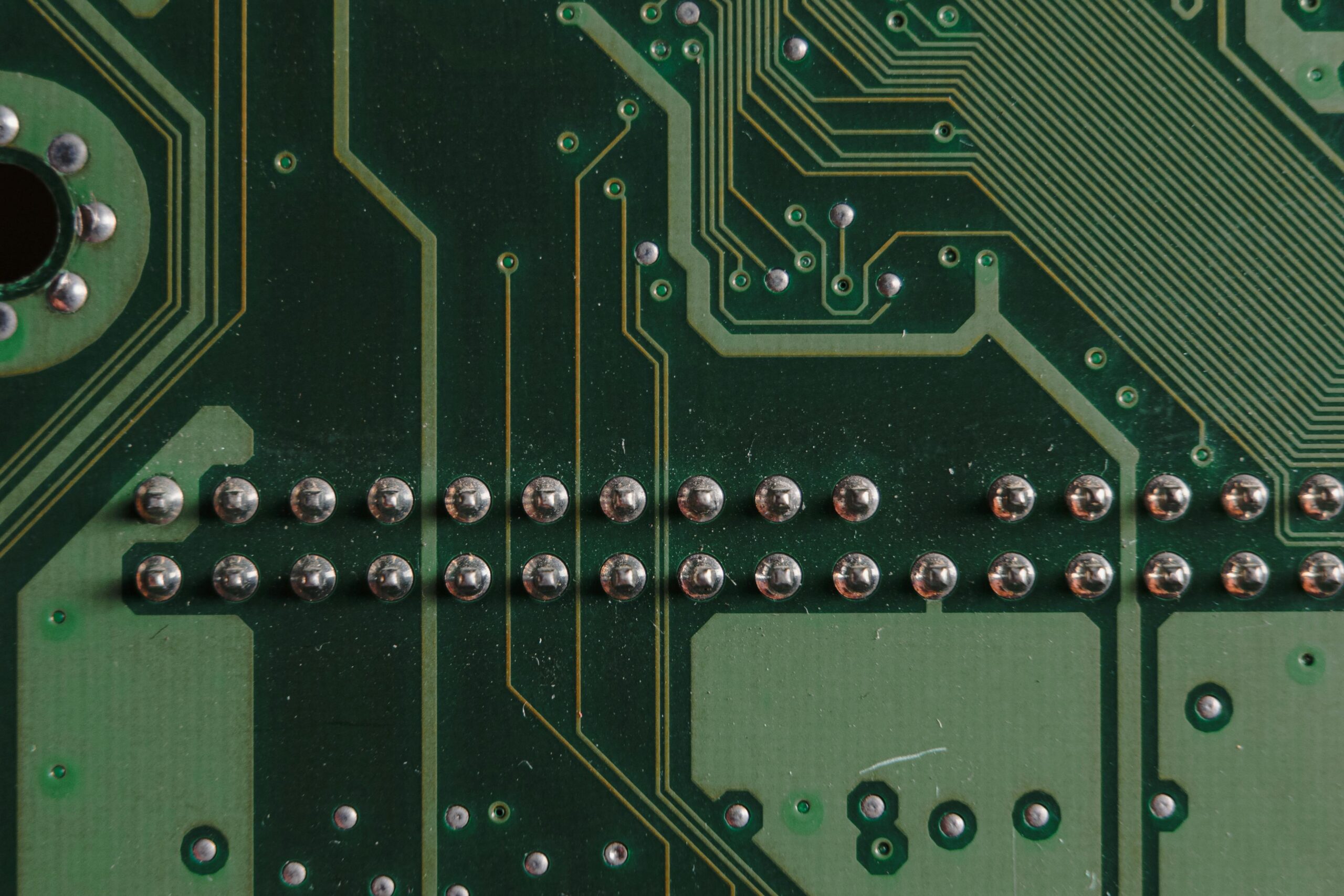 Detailed close-up image of a circuit board showcasing soldered components and circuit pathways.